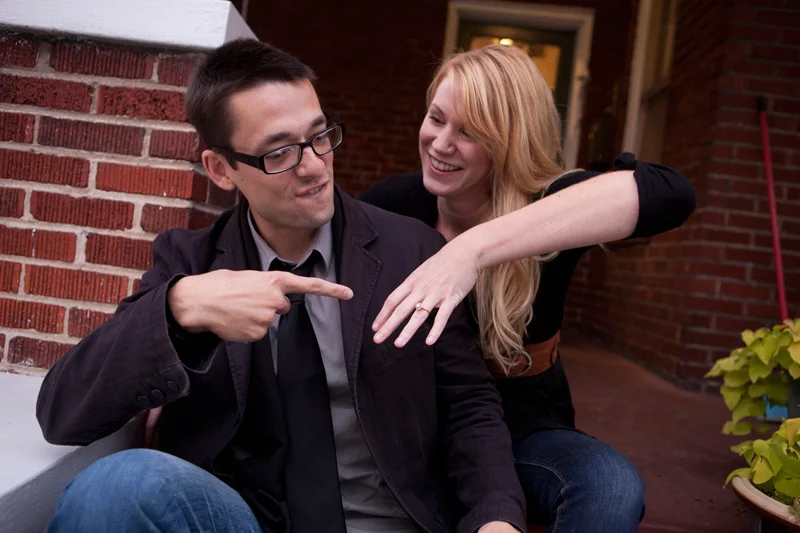man and woman engagement image with ring