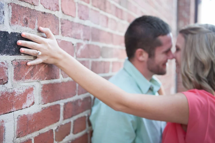 man and woman engagement image with ring