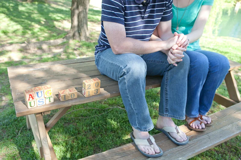 man and woman engagement image on picnic table