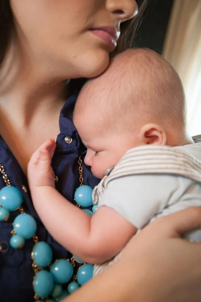 woman with sleeping baby
